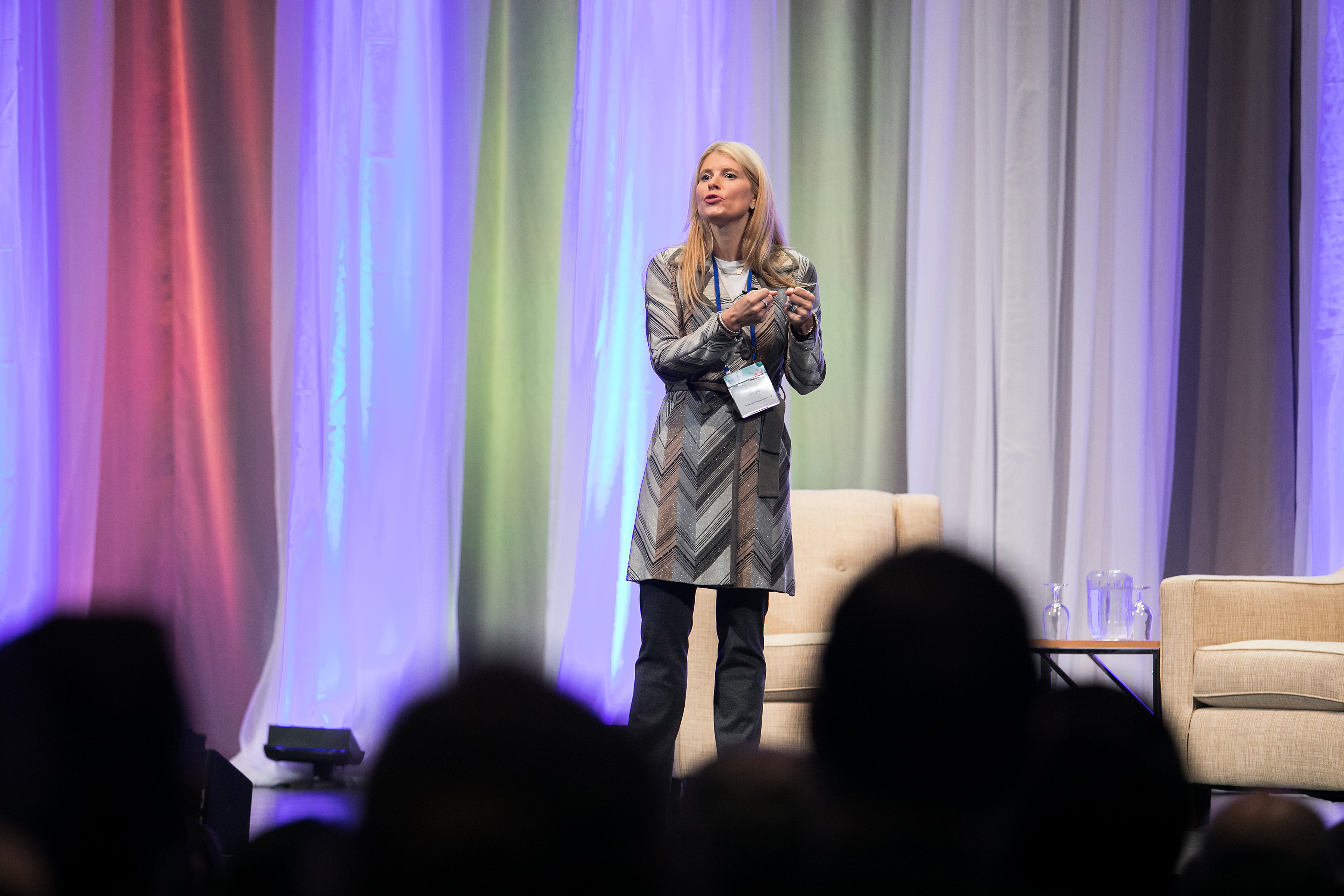Shannon Schuyler, Chief Purpose Officer at PwC, speaking onstage at the 2017 Net Impact  Conference during her keynote session.